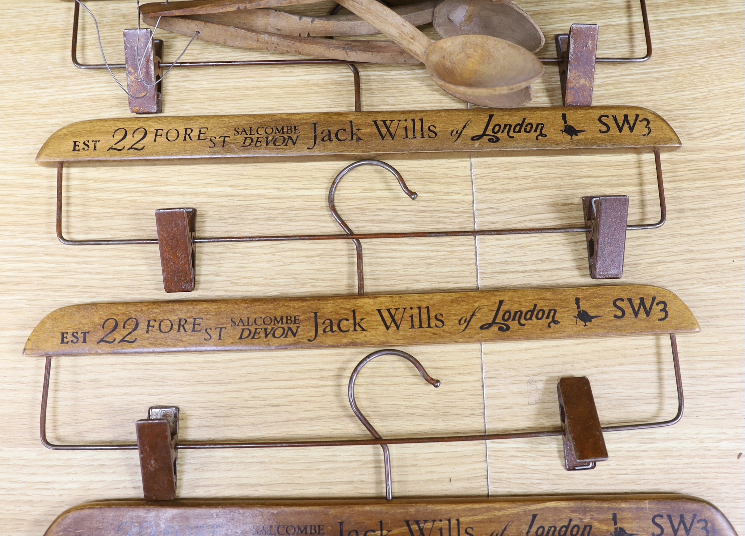 A quantity of Victorian carved wood spoons and four Jack Wills clothes hangers